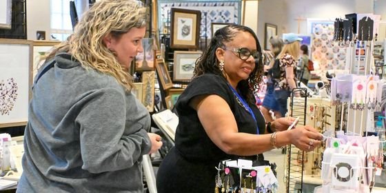 Two women shopping for arts and crafts at the Gallery at York Hall