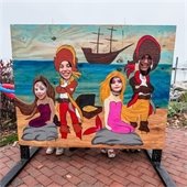 Family posing for pics inside Maritime Photo Cutout