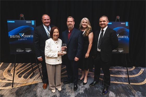 Attached photo from left to right:  Brian Fuller, Deputy Count Administrator, Teri Takai, Senior Vice President at the Center for Digital Government (CDG), Tim Wyatt, Director of Information Technology, Erika Alderman, Chief of Business Applications, and David Brooks, Helpdesk Supervisor.