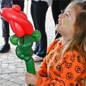 Girl holding balloon from Fall Festival
