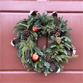 Holiday wreath on red berry door